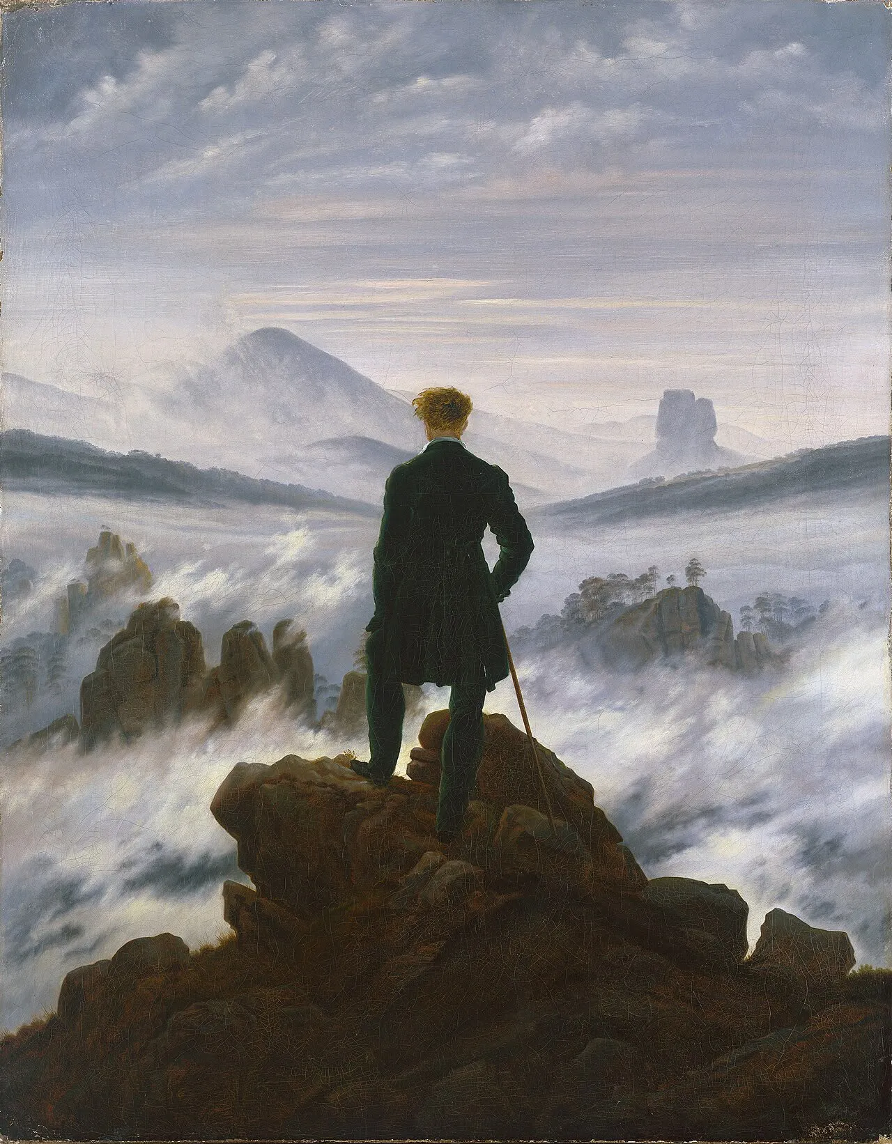 Dipinto di un viandante visto di spalle, in piedi su una roccia, che guarda un paesaggio di montagne avvolto da un mare di nebbia